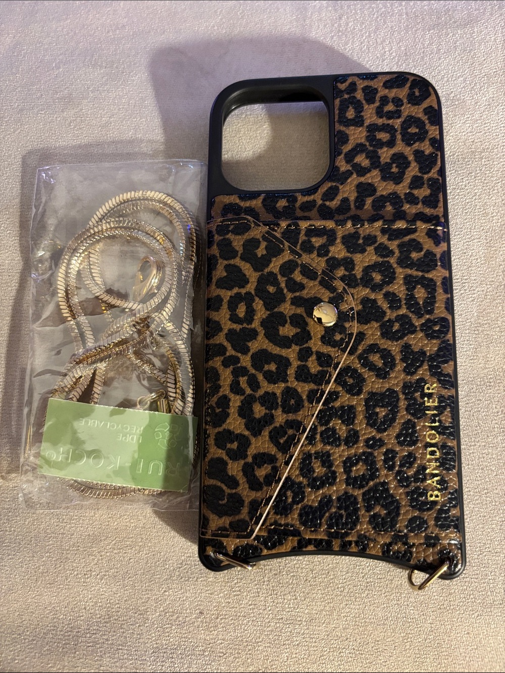 Bandolier 14 Pro Max Leopard Print Phone Case and Gold chain strap.